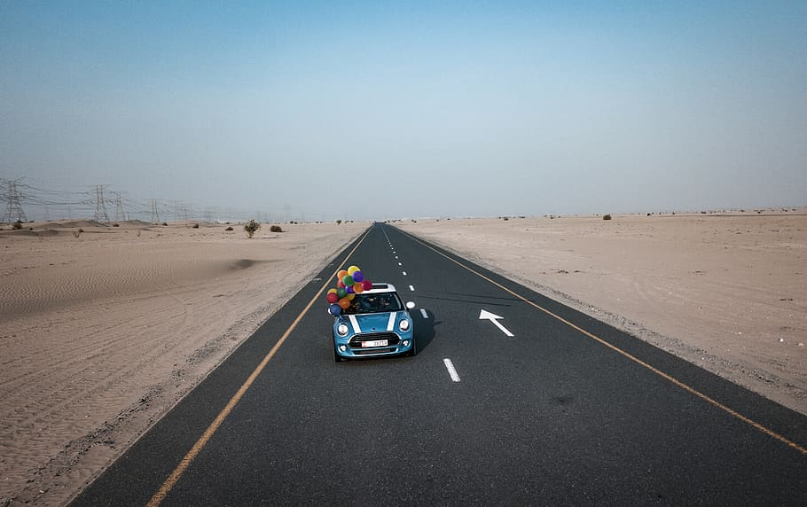Blue and White Mini Cooper With Balloons Running on Road, action HD wallpaper