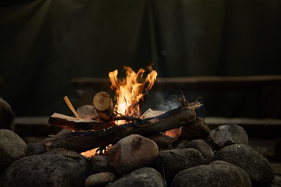 Burning Wood Above Rocks, bonfire, campfire, firewood, flame HD wallpaper
