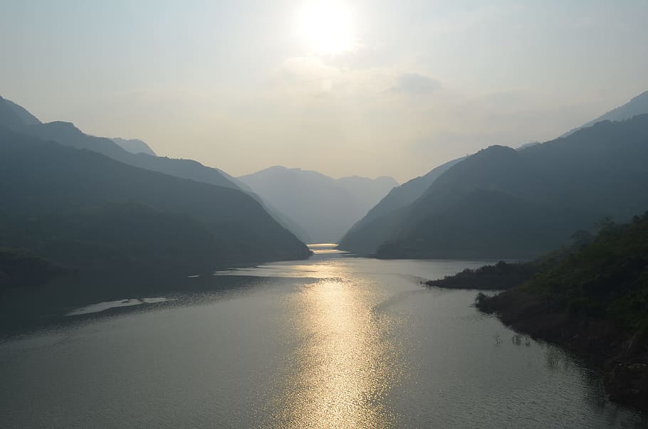 Brown Mountain Near Body of Water, calm, hazy, lake, landscape HD wallpaper