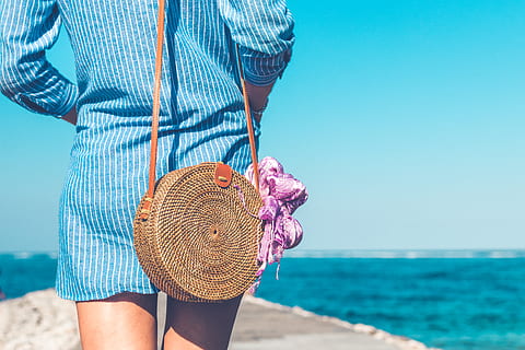 Woman Wearing Blue and White Striped Dress With Brown Rattan Crossbody Bag Near Ocean HD wallpaper