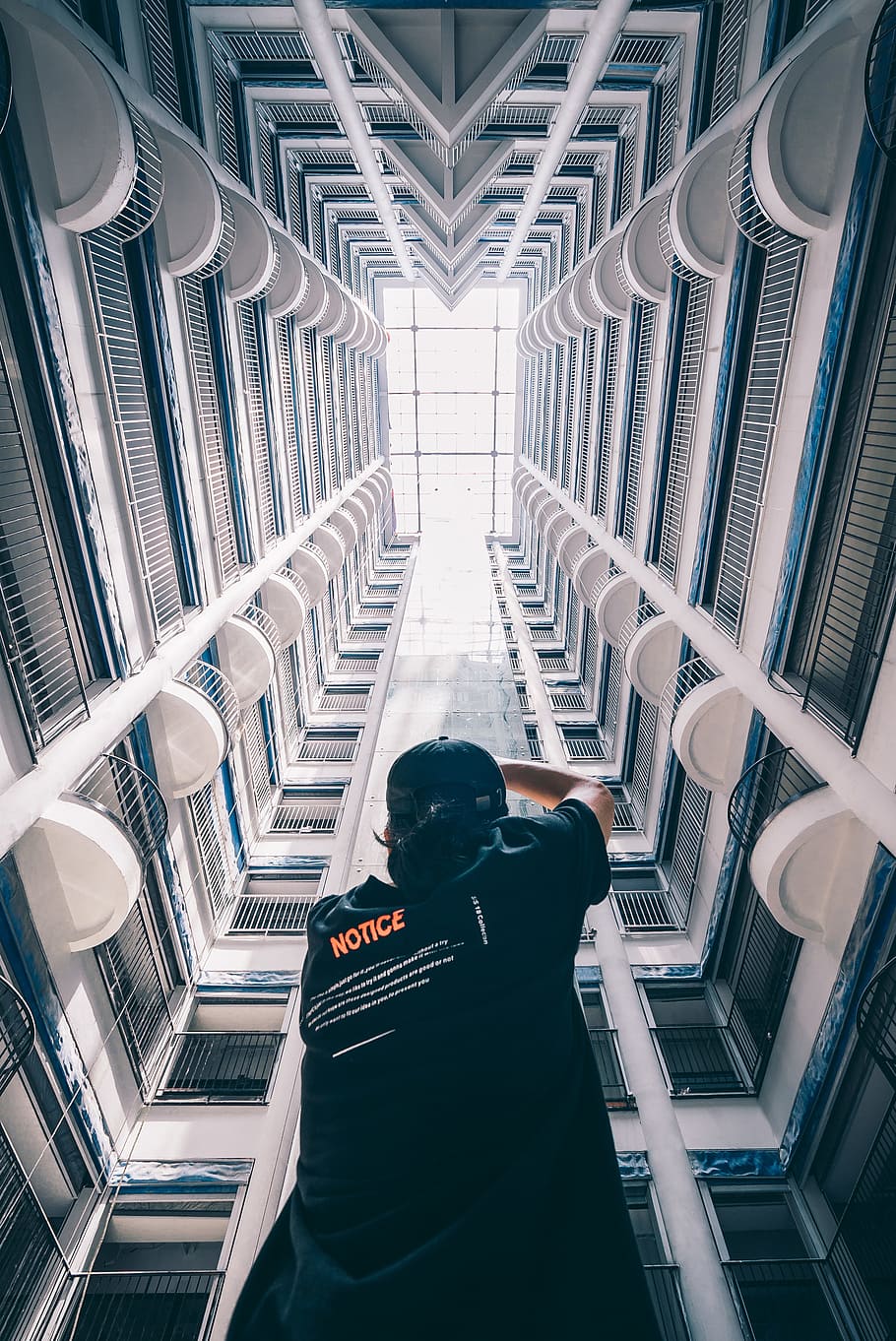 man in black T-shirt standing inside building, china, rooftop HD wallpaper