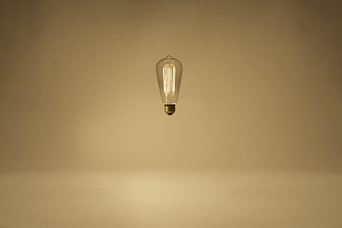 lighted clear light bulb floating in mid air, magic, minimal HD wallpaper