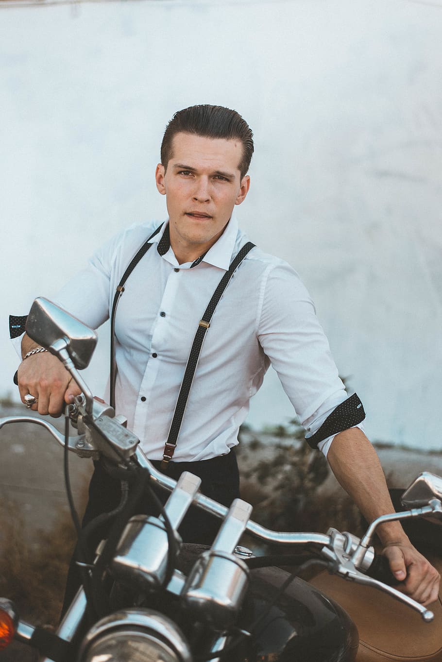 Man in White Dress Shirt With Suspenders Holding Black Motorcycle HD wallpaper