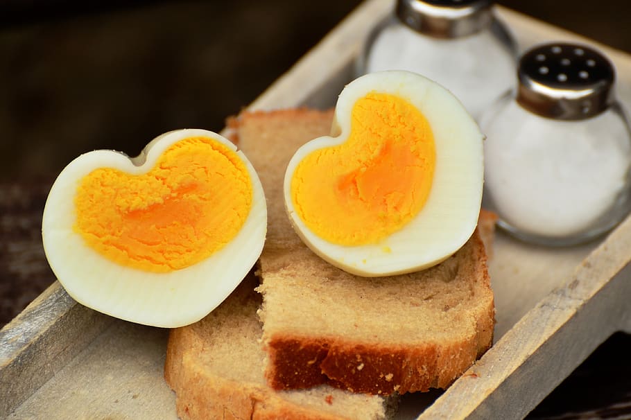 Boiled Egg on Top on Bread Beside Salt Shaker, egg yolk, food HD wallpaper