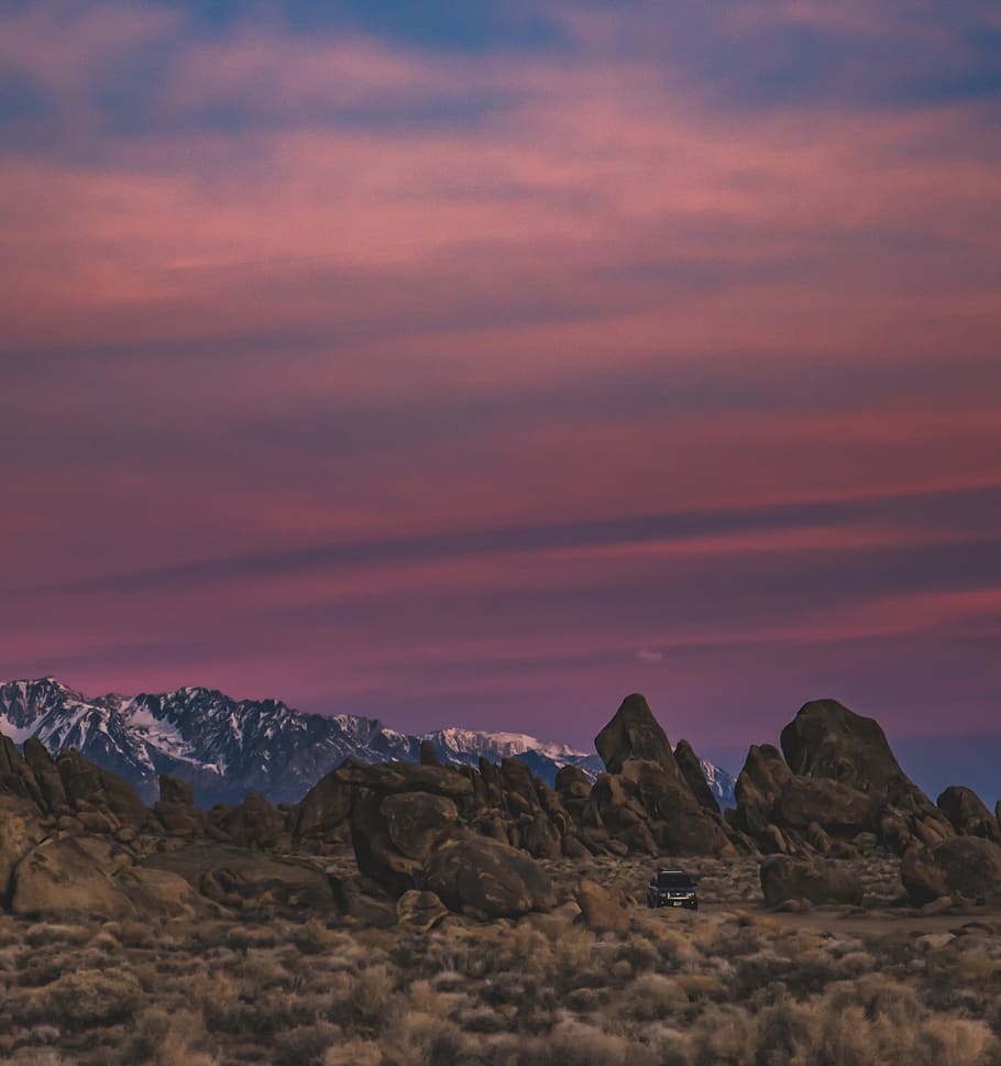 brown rock formation under brown sky, nature, outdoors, mountain range HD wallpaper