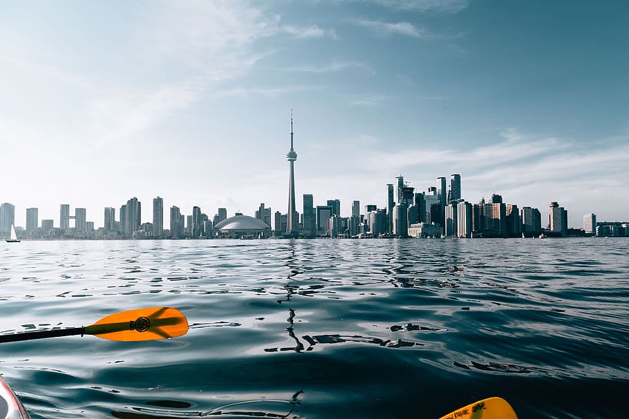 Paddling By City Skyline Photo, Nature and Landscapes, Travel