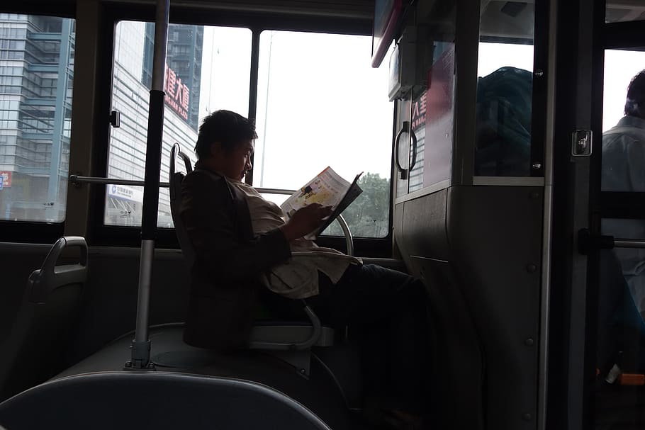 china, human, person, reading, cushion, sitting, reading in bus