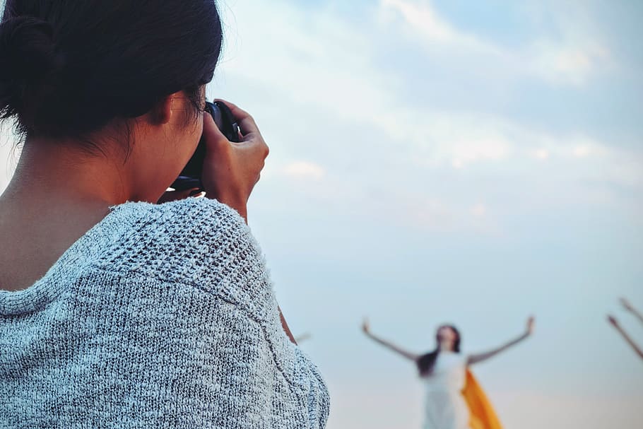 Woman Taking Picture of Woman Dancing Under White Sky, blur, camera HD wallpaper