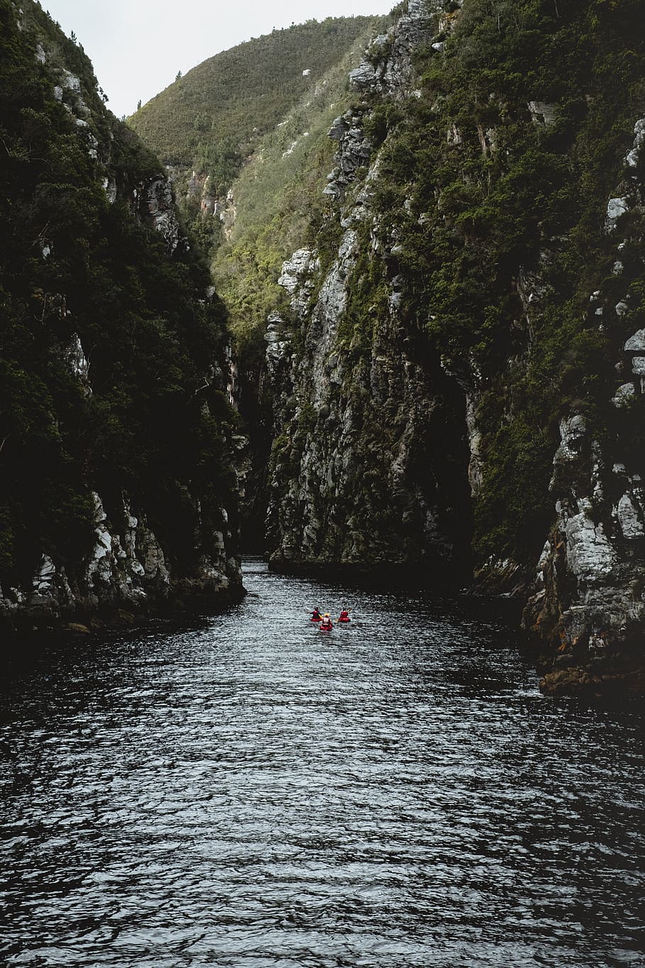 people in river between mountain gorge, water, beauty in nature HD wallpaper