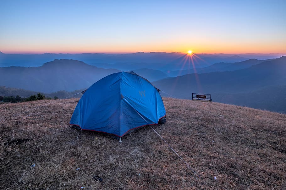 blue camping tent onhill during golden hour, leisure activities