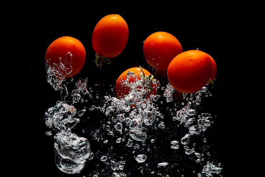 Five Tomatoes In Body Of Water , food, fruit, black background HD wallpaper