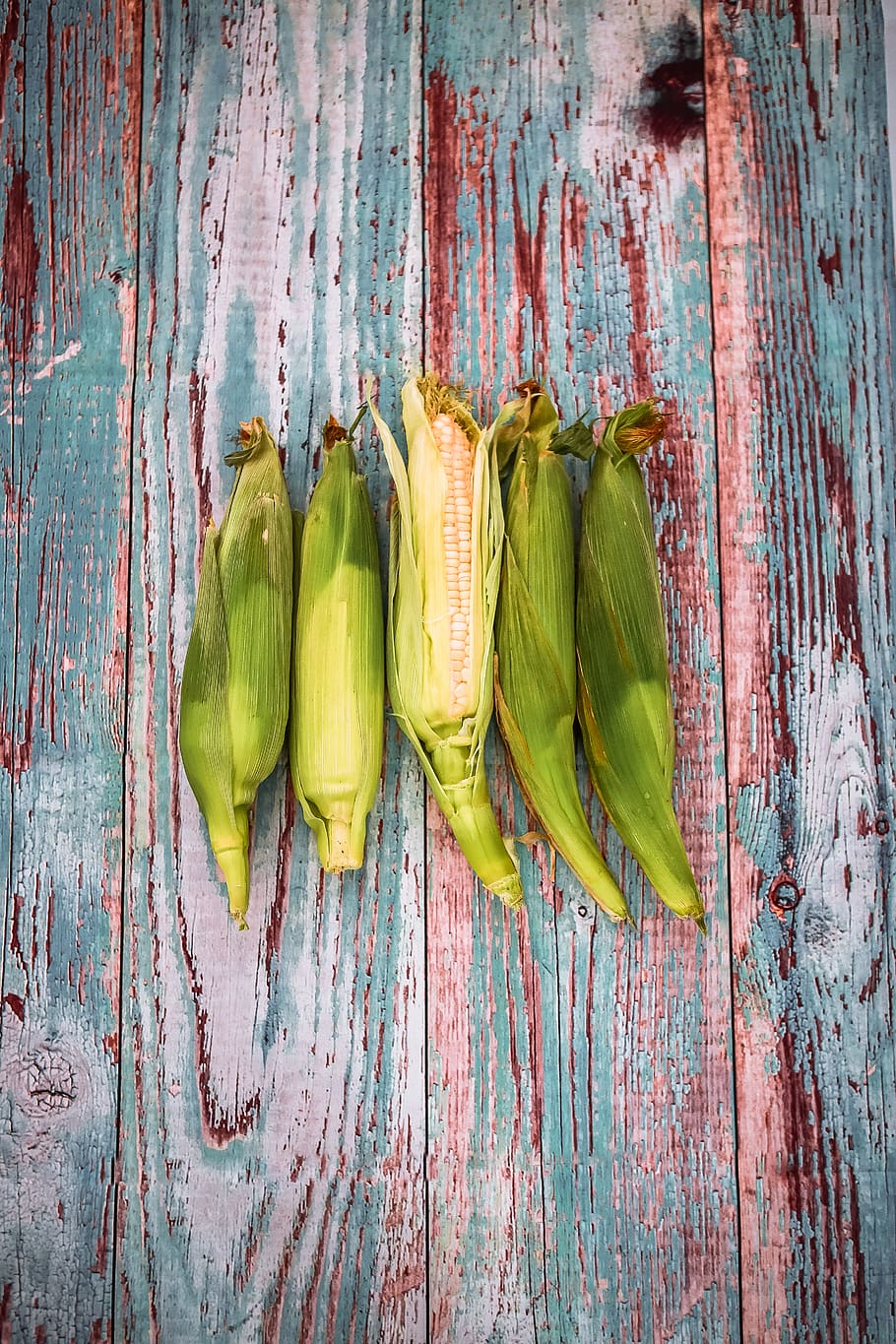 green corns on wooden surface, plant, food, vegetable, farm, produce