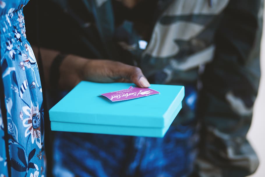 person holding blue box, human hand, midsection, one person, communication HD wallpaper