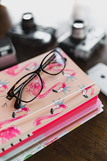 Pink calendar, notebook, diary, desk, table, eyeglasses, indoors HD wallpaper