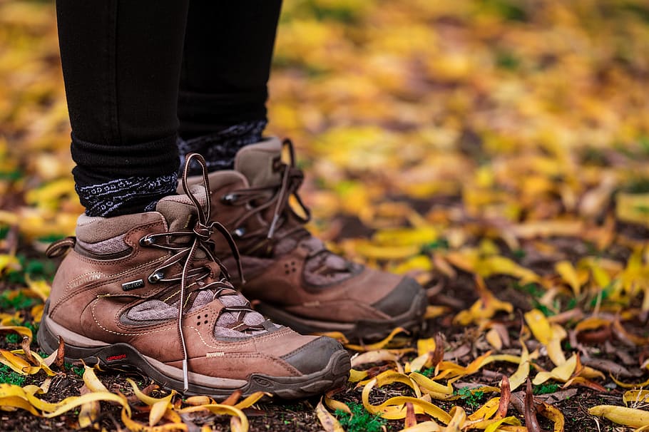 person wearing brown hiking boots, leaf, leaves, fashion, style