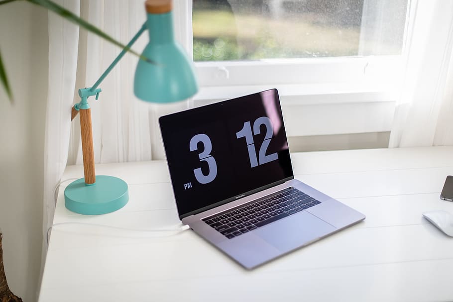 black and gray laptop computer turned on, clock, screen, table HD wallpaper