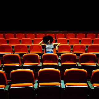 Woman Sitting Inside A Theater, afro, audience, auditorium, bored HD wallpaper