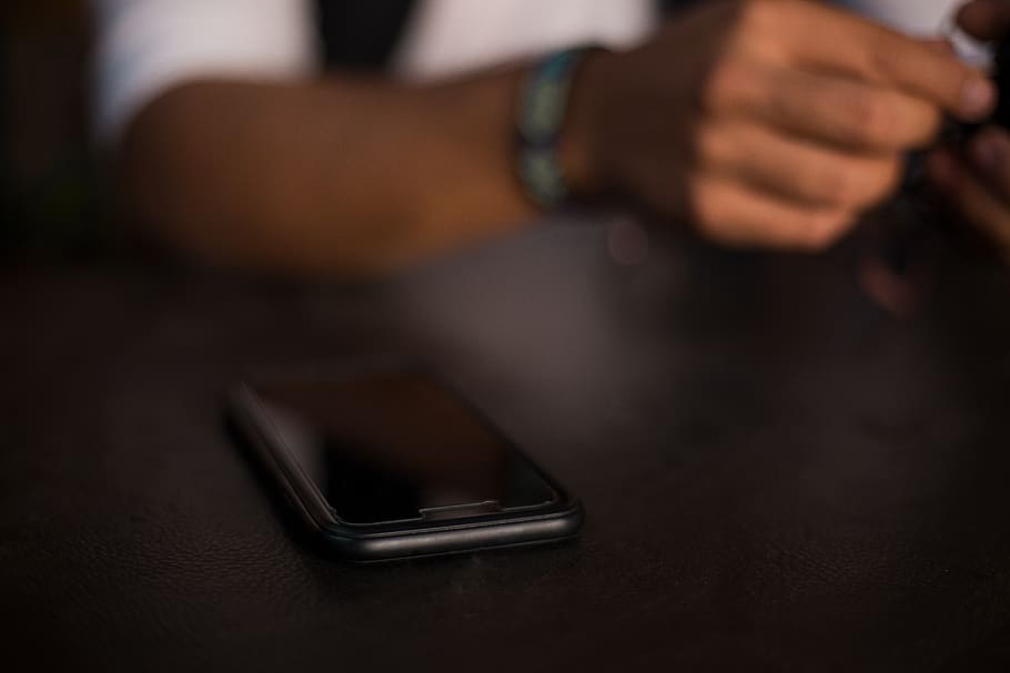 Black Iphone on Table, cell, cell phone, device, portable, selective focus HD wallpaper