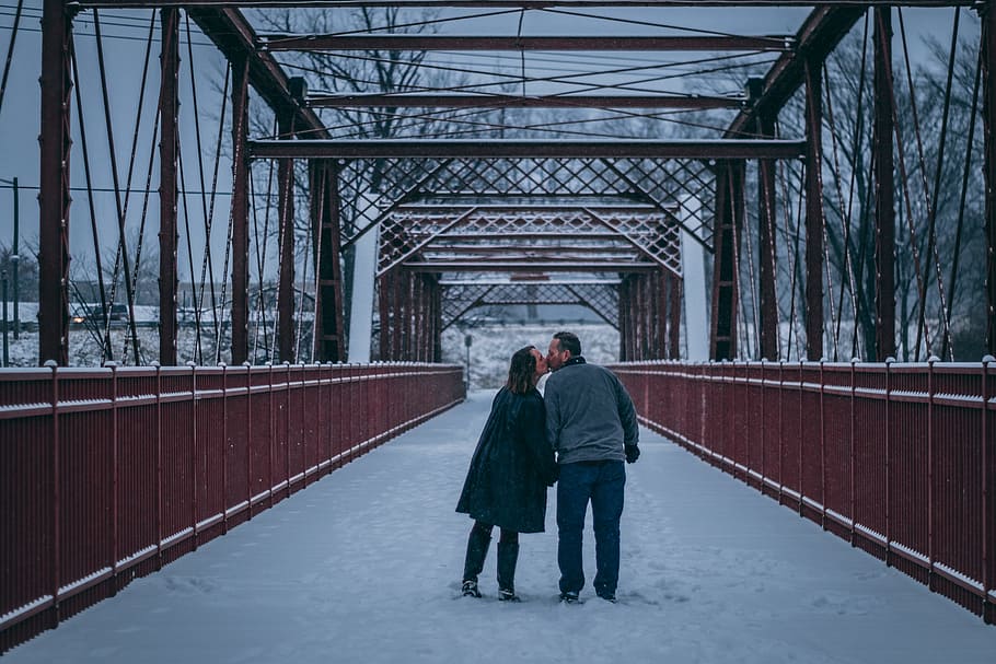 Couple Kissing on Bridge Covered With Snow, connection, daylight HD wallpaper