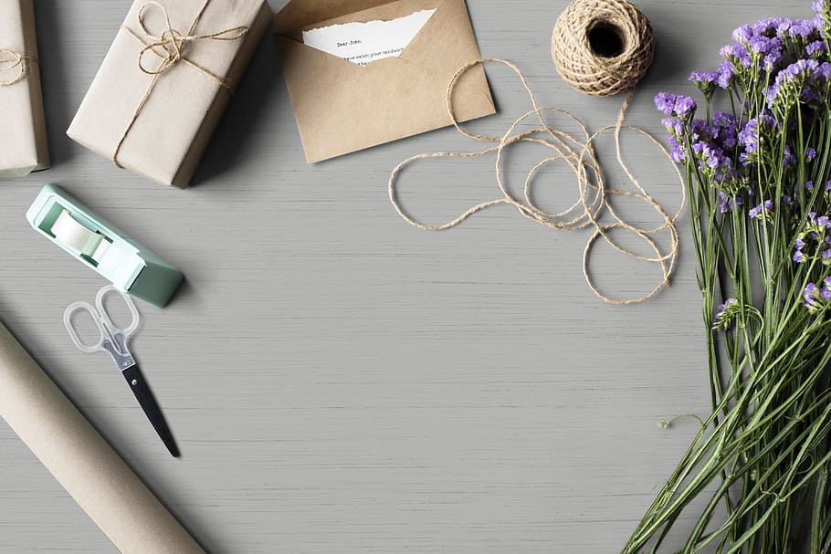 High-angle Photo of Purple Flowers, Brown Yarn and Brown Envelopeon Gray Table HD wallpaper