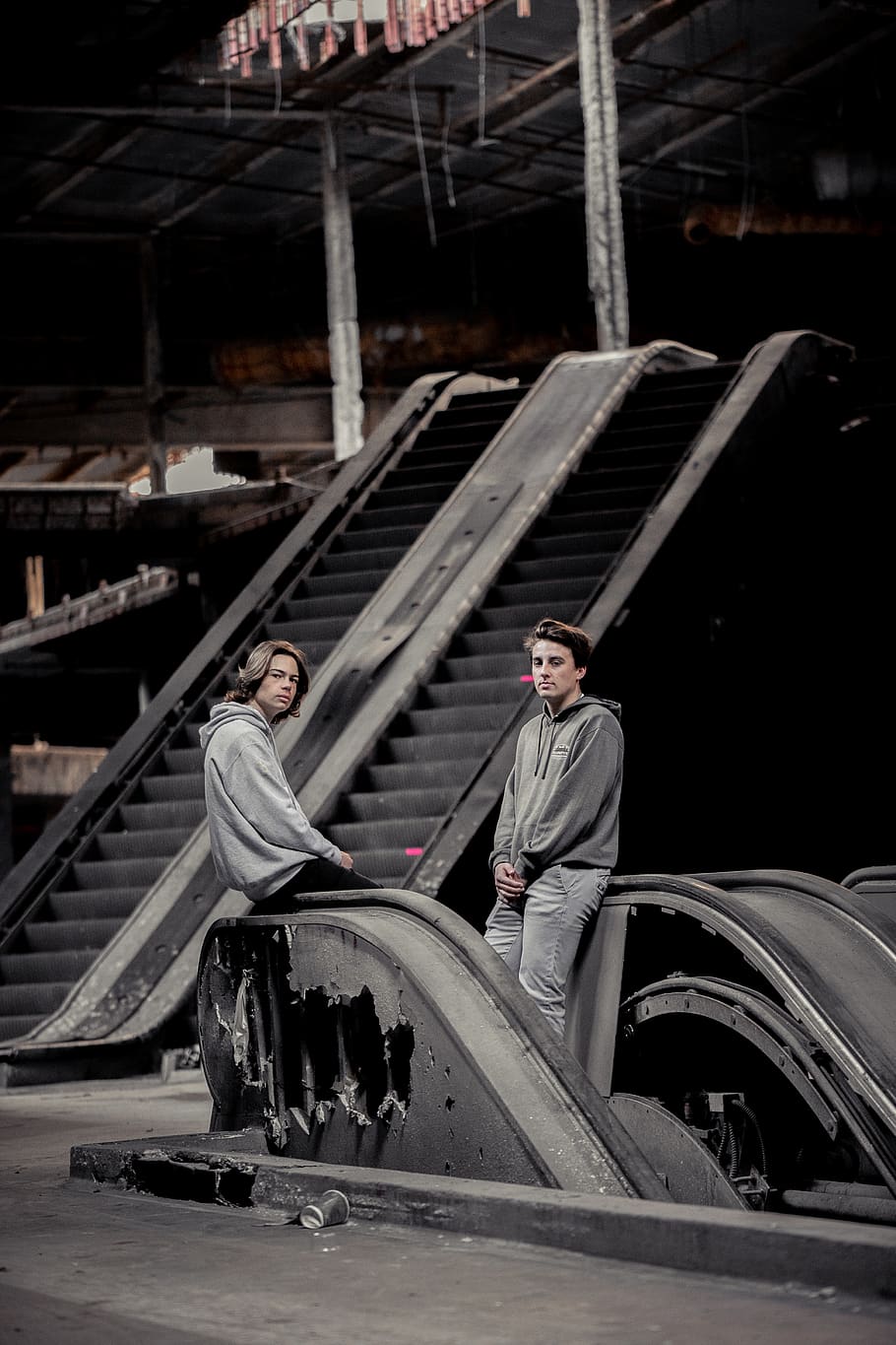 two men sitting on railing inside building, banister, handrail HD wallpaper