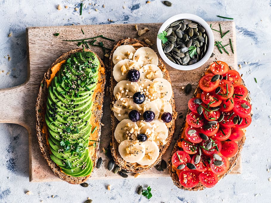 assorted fruits and vegetable on brown wooden chopping board HD wallpaper