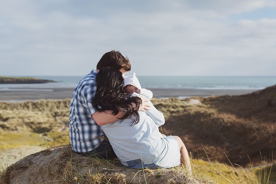 Man and Woman Sitting on Stone Carrying Baby, adorable, back view HD wallpaper