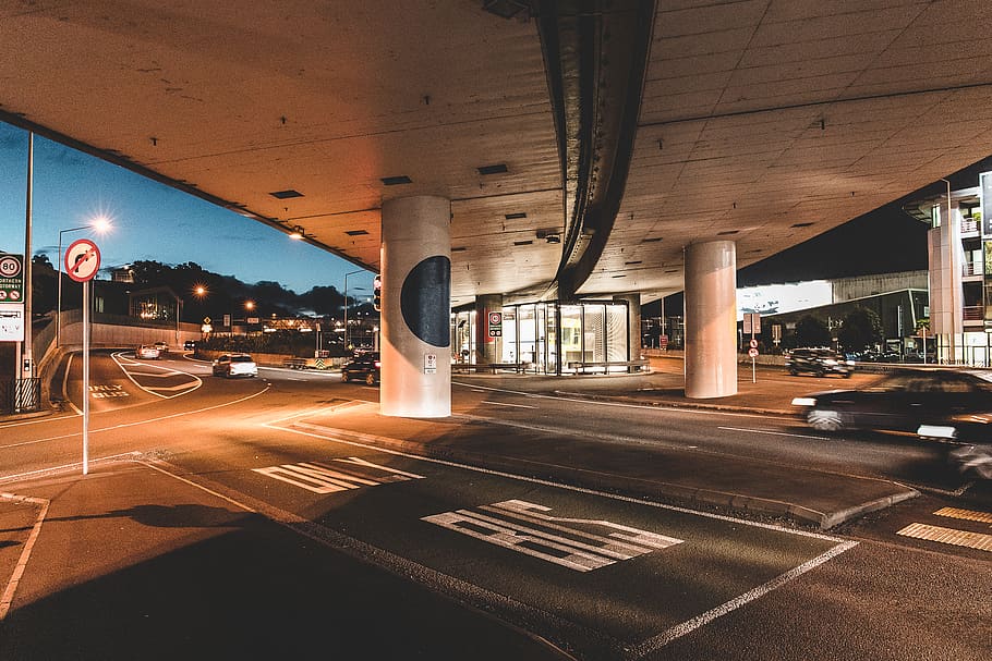 car under bridge, airport terminal, victoria street west, new zealand HD wallpaper