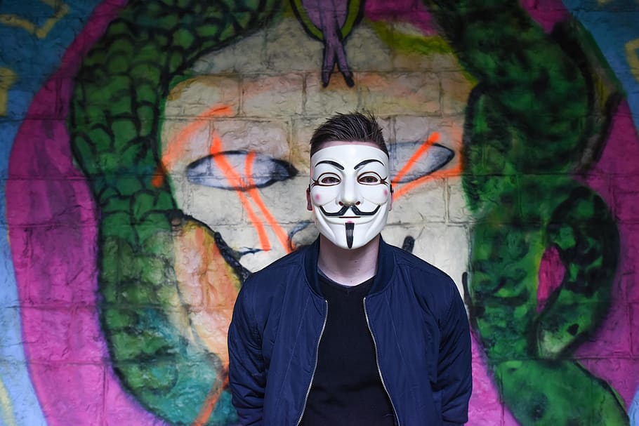 Man in White Mask in Black Crew Neck Shirt and Blue Zip Up Jacket Infront Graffiti Wall, HD wallpaper