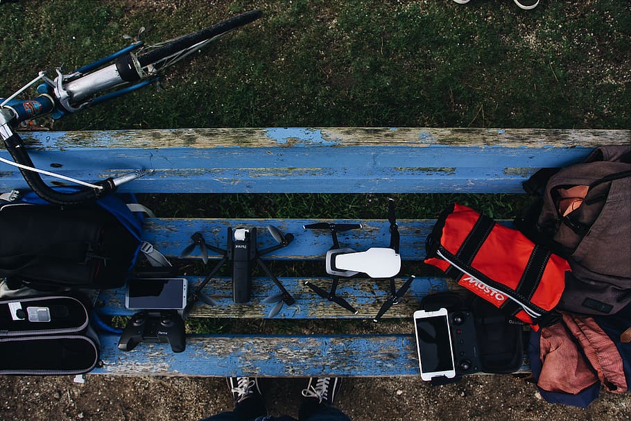 black and white drones on blue wooden bench, apparel, clothing