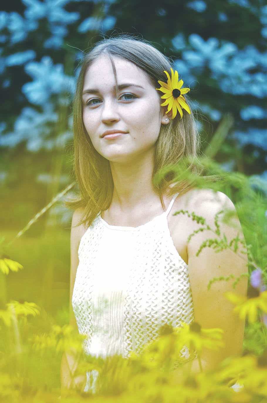 woman with sunflower on ear, portrait, nature, plant, one person HD wallpaper