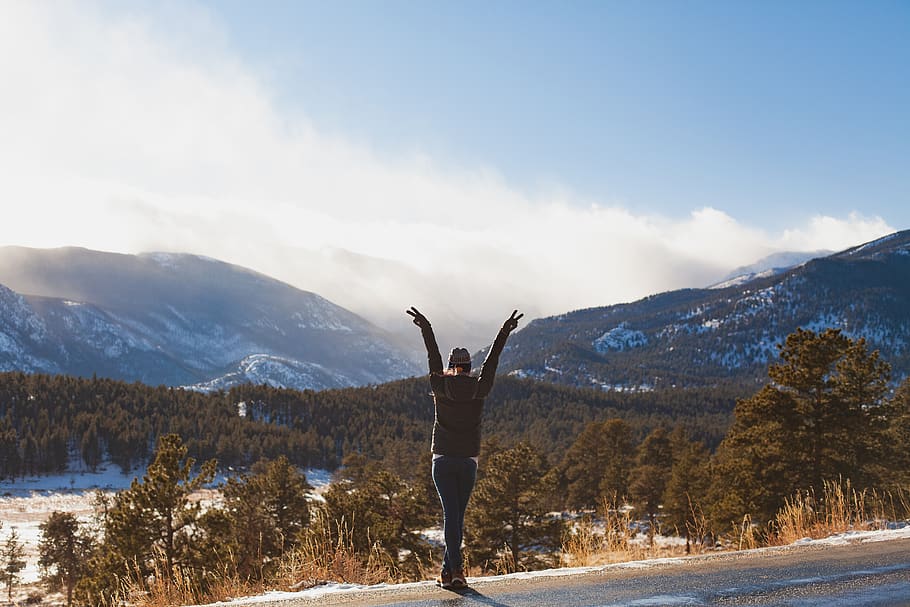 Person Raising Hands on Road Across Mountain Range, adventure HD wallpaper