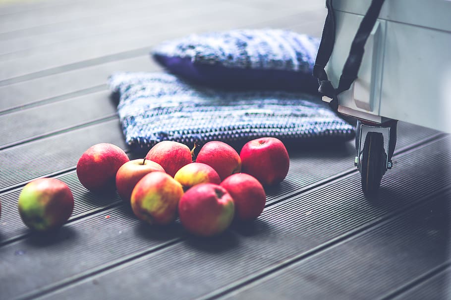 Red apples on the floor, blue, blur, bright, color, cushion, decor HD wallpaper