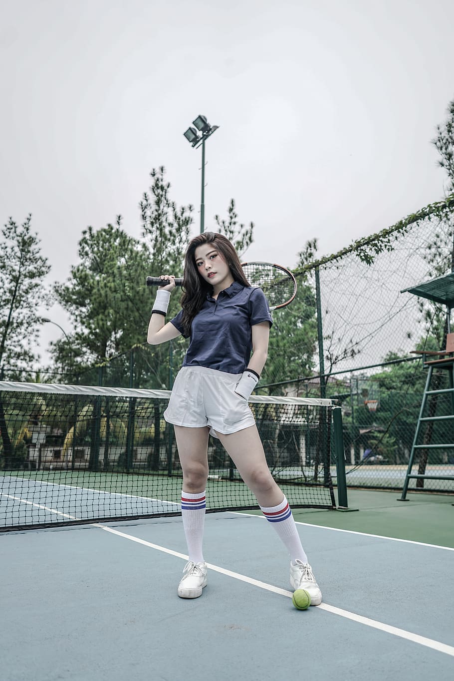 woman holding badminton racket, full length, sport, real people