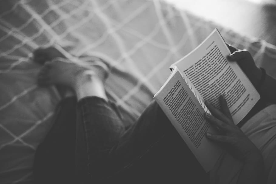 grayscale photography person reading book on top of bed, leg, HD wallpaper