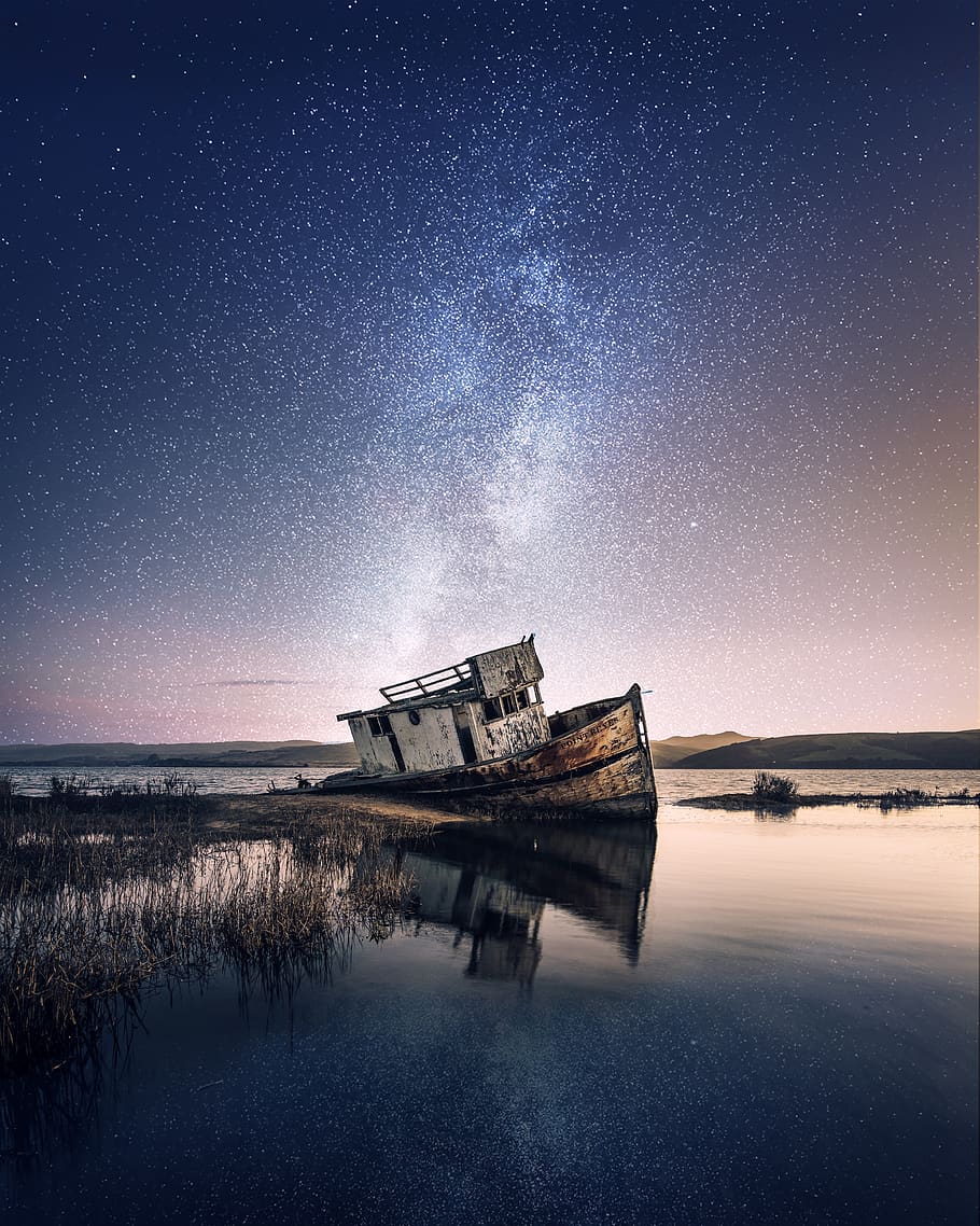 HD wallpaper: Wrecked Ship on Body of Water With Galaxy Background,  abandoned | Wallpaper Flare