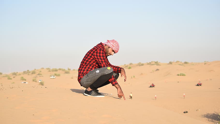 Man in Flannel Shirt Sitting on Sand, action, daylight, desert HD wallpaper
