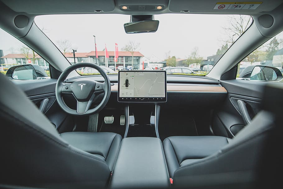 turned on car GPS navigator on Tesla car, automobile, vehicle