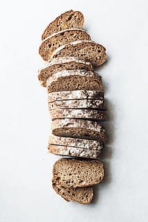 sliced breads on white surface, food, flour, minimal, wholemeal HD wallpaper