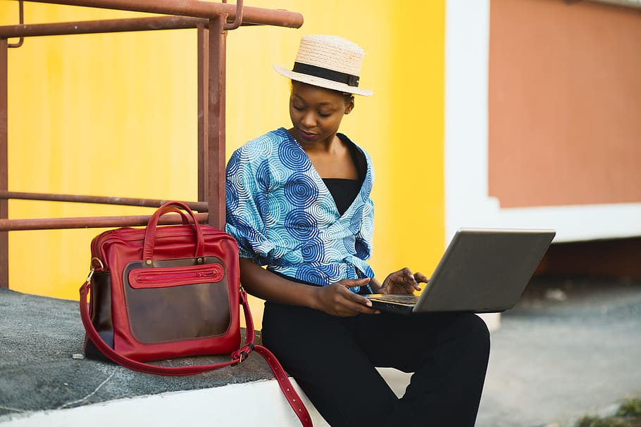Woman Sitting Beside Bag And Using Laptop, beautiful, computer HD wallpaper