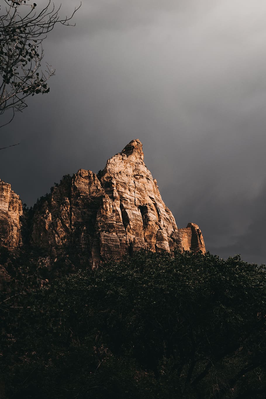 brown monolith in gray cloud background, peak, rock, sky, sunlight HD wallpaper