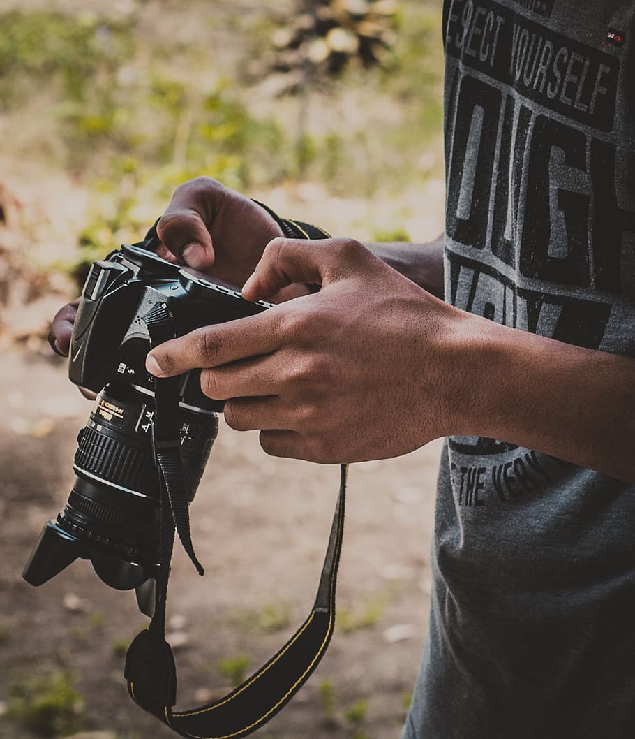 Man Holding Dslr Camera, hands, nikon, person, human hand, real people HD wallpaper