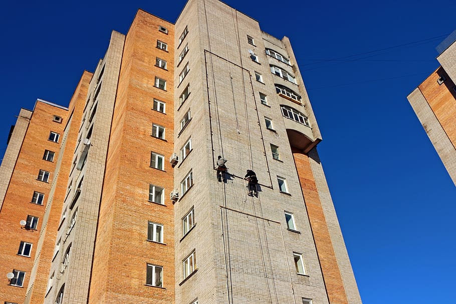 Person Hanging on a High Rise Building, architecture, low angle shot HD wallpaper