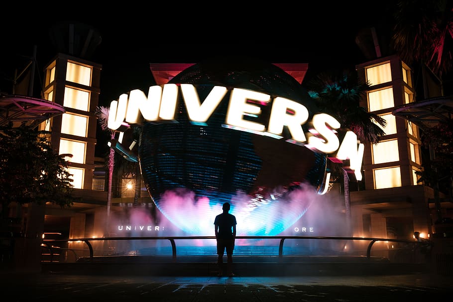 man standing in front of Universal Studio, world, globe, ball, HD wallpaper