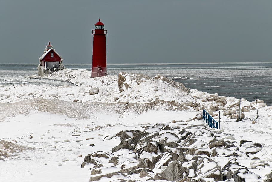 red lighthouse, water, sea, tower, guidance, beach, land, nature HD wallpaper
