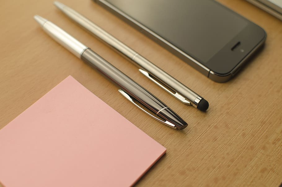 Two Click Pens Beside Iphone on Table, cellphone, desk, fountain pen, HD wallpaper