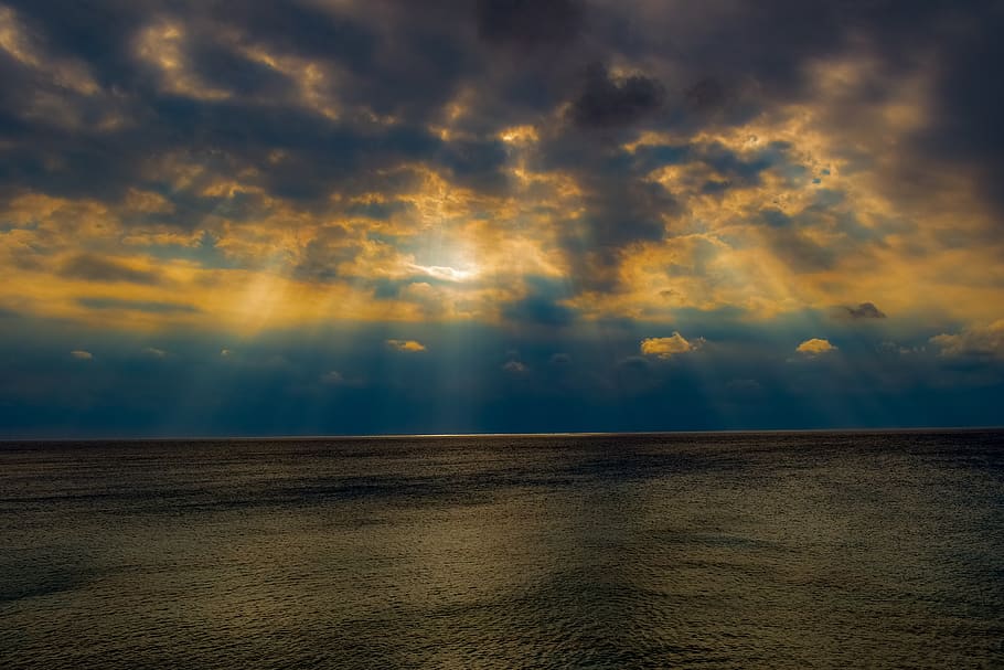 sea, sky, clouds, horizon, dark, light, sunlight, sunbeam, nature HD wallpaper