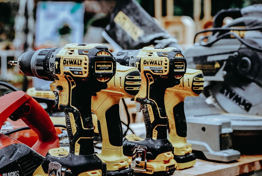 yellow Dewalt hand drills on table, focus on foreground, close-up, HD wallpaper
