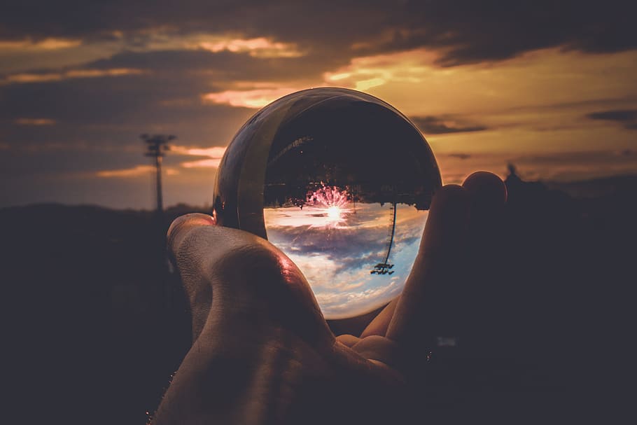 Person Holding Clear Glass Ball, close -up, clouds, crystal ball