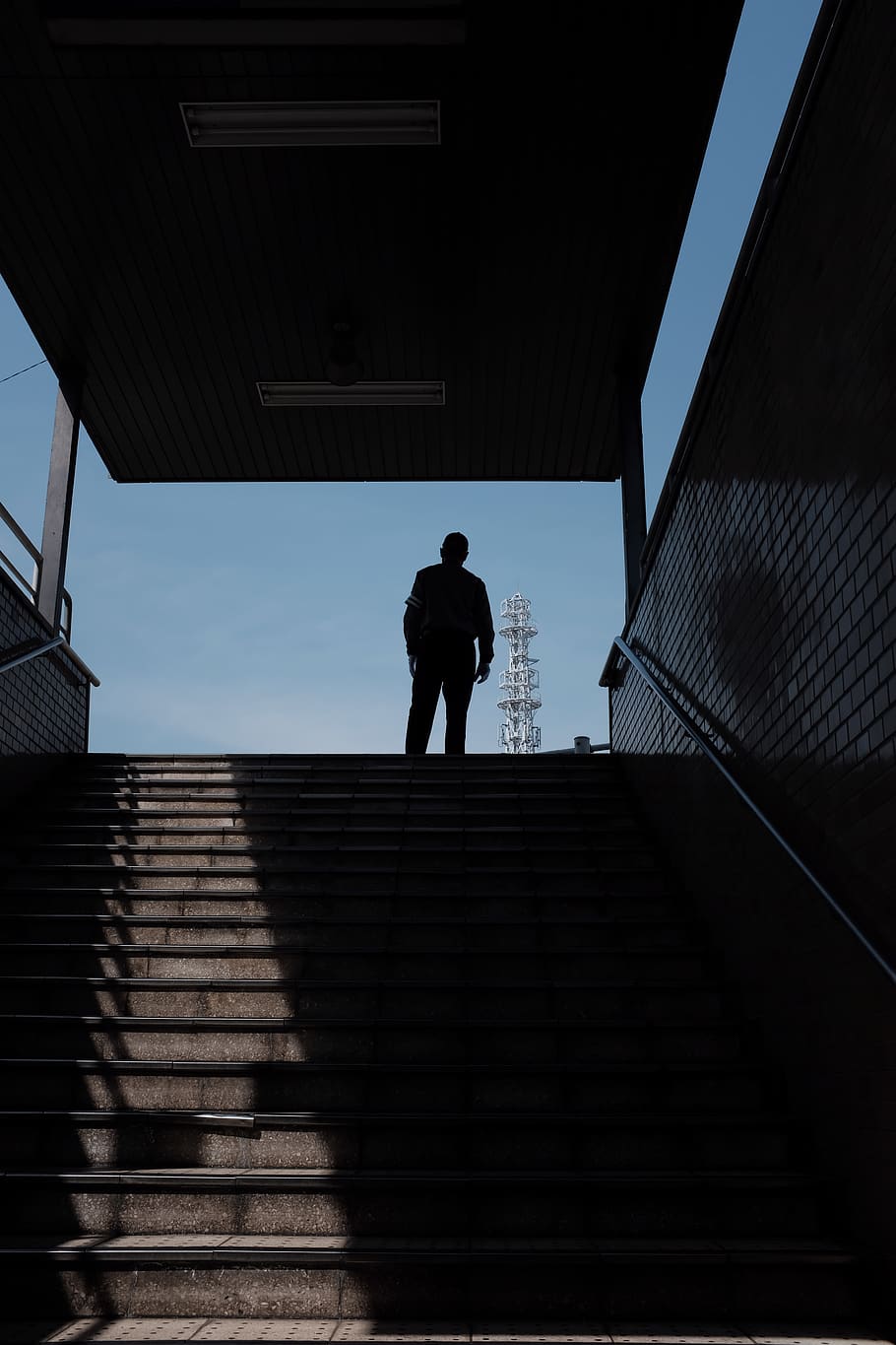 silhouette of man standing on stair, banister, handrail, human